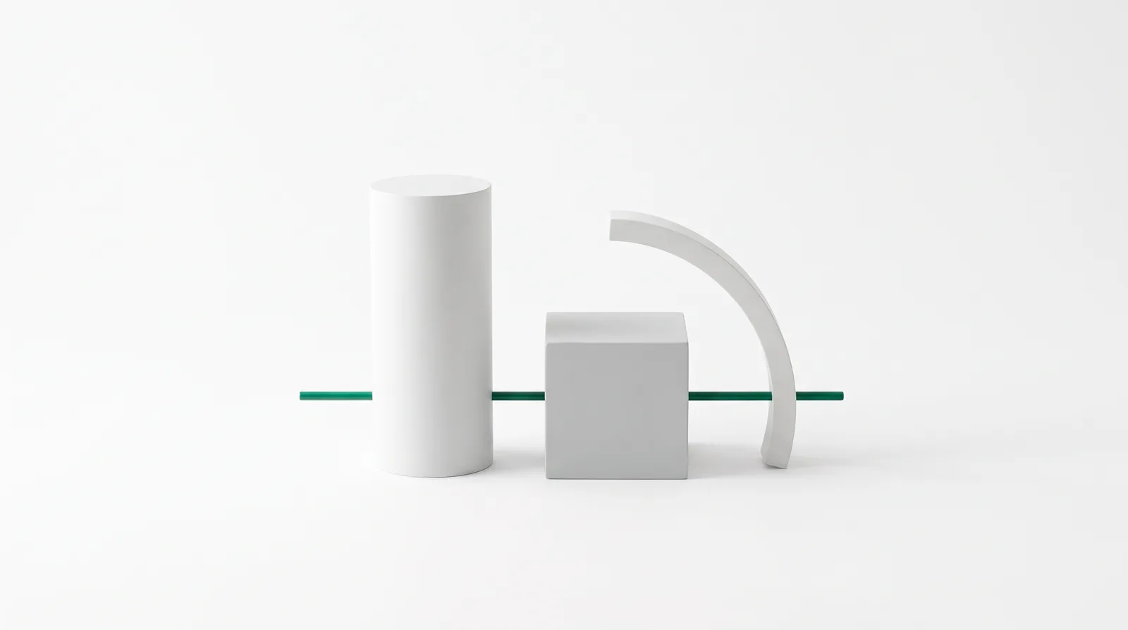 White cylinder, cube and arc on a bright studio ground, threaded by a single straight green rod